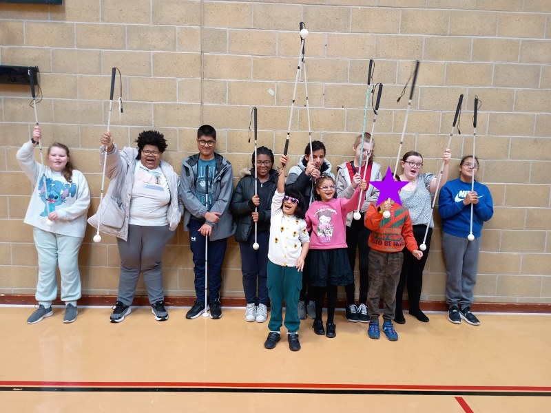 11 young people celebrating the long cane at the Cane and Games workshop.jpg